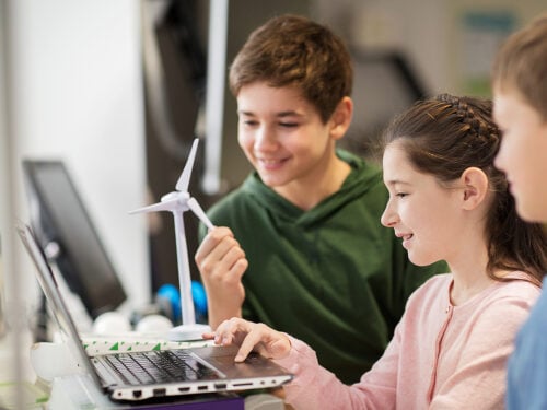 kids with laptop and wind turbine at school