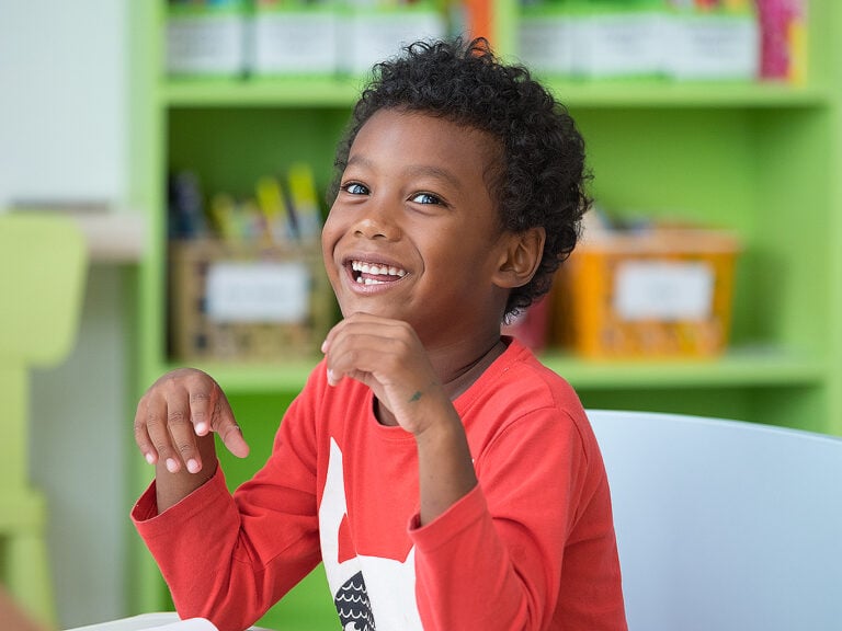 Little boy smiling in school